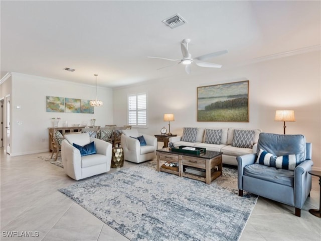 11992 Arbor Trace Dr, Fort Myers, FL 33913 - living room with crown molding, ceiling fan, tile patterned flooring, and a chandelier