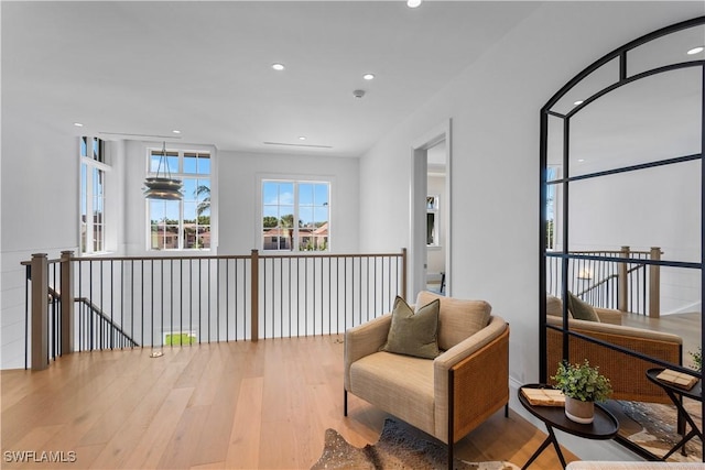 845 11th Ave S, Naples, FL 34102 - living area featuring wood finished floors, recessed lighting, and an upstairs landing