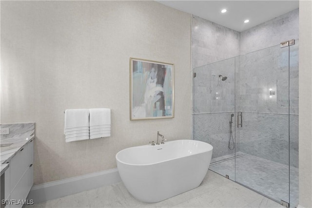 845 11th Ave S, Naples, FL 34102 - bathroom with vanity, a freestanding tub, a shower stall, baseboards, and recessed lighting