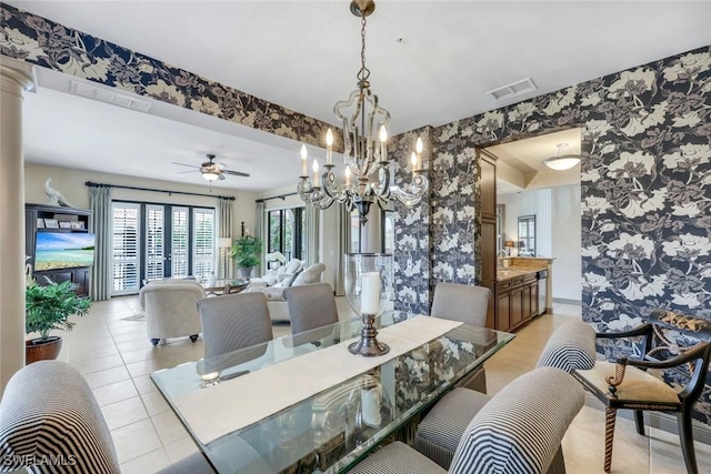 23159 Amgci Way Unit 302, Estero, FL 33928 - dining room with wallpapered walls, light tile patterned floors, a chandelier, a ceiling fan, and baseboards