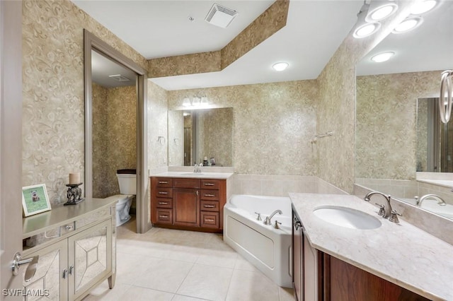 23159 Amgci Way Unit 302, Estero, FL 33928 - bathroom with a garden tub, tile patterned flooring, two vanities, toilet, and wallpapered walls