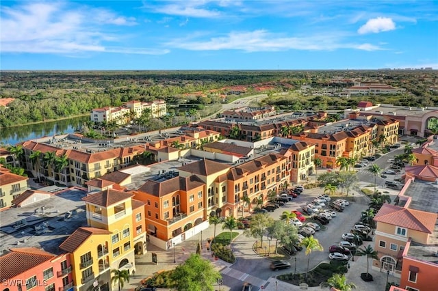 23159 Amgci Way Unit 302, Estero, FL 33928 - drone / aerial view of apartment complex and a nearby body of water