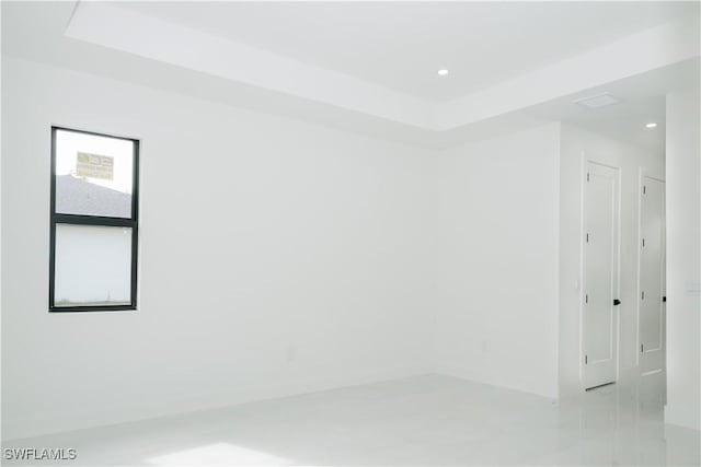 718 Calvin Ave, Lehigh Acres, FL 33972 - unfurnished room with a raised ceiling, recessed lighting, and baseboards