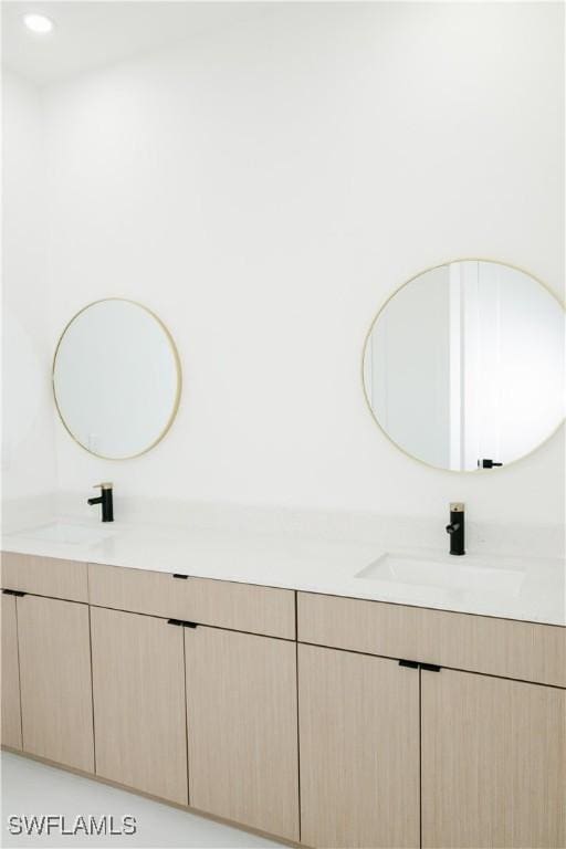 718 Calvin Ave, Lehigh Acres, FL 33972 - bathroom featuring double vanity and recessed lighting
