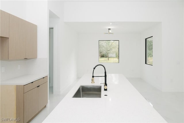 718 Calvin Ave, Lehigh Acres, FL 33972 - kitchen featuring a sink, modern cabinets, light countertops, and light brown cabinets