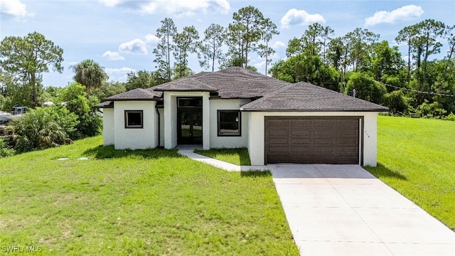 718 Calvin Ave, Lehigh Acres, FL 33972 - view of front of home with a garage, a front yard, stucco siding, and driveway