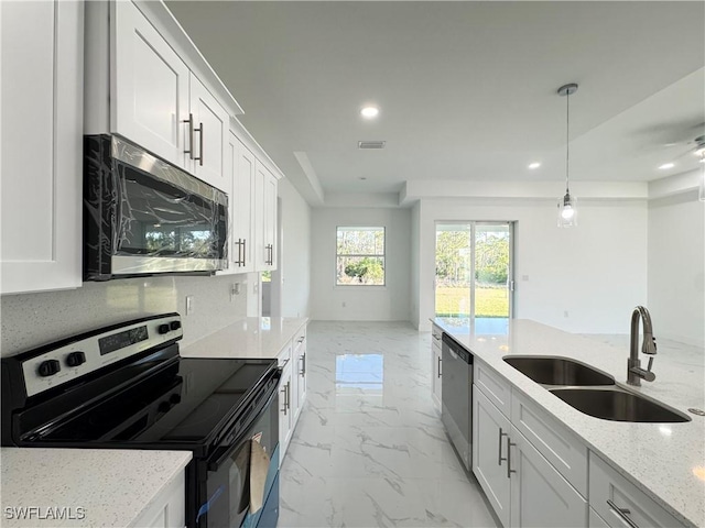 2933 Van Buren Pkwy, Cape Coral, FL 33993 - kitchen with appliances with stainless steel finishes, a sink, light marble finish floors, recessed lighting, and light stone countertops