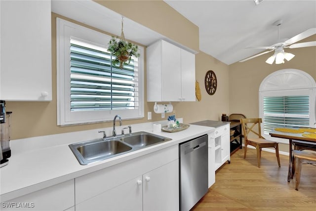 291 Mango St, Fort Myers Beach, FL 33931 - kitchen with dishwasher, a sink, light countertops, and white cabinetry