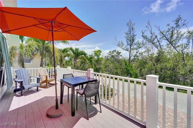 291 Mango St, Fort Myers Beach, FL 33931 - wooden deck featuring outdoor dining area