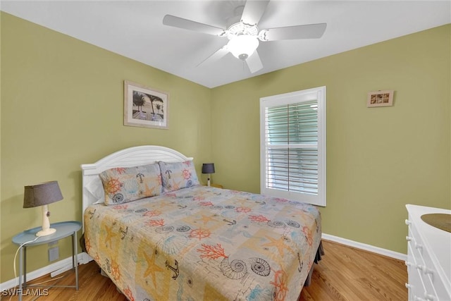 291 Mango St, Fort Myers Beach, FL 33931 - bedroom featuring baseboards, wood finished floors, and ceiling fan