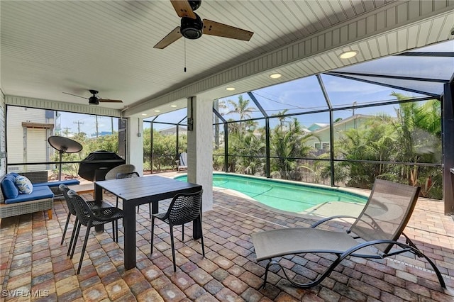 291 Mango St, Fort Myers Beach, FL 33931 - view of patio featuring a ceiling fan, an outdoor pool, glass enclosure, and outdoor lounge area