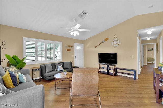 291 Mango St, Fort Myers Beach, FL 33931 - living room with lofted ceiling, light wood-style floors, and a ceiling fan