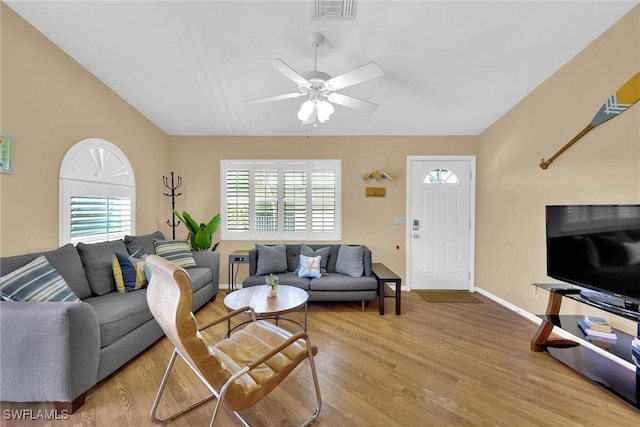 291 Mango St, Fort Myers Beach, FL 33931 - living room featuring a ceiling fan, wood finished floors, and baseboards