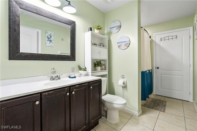 2909 48th St SW, Lehigh Acres, FL 33976 - full bathroom featuring vanity, tile patterned floors, toilet, baseboards, and a shower with shower curtain