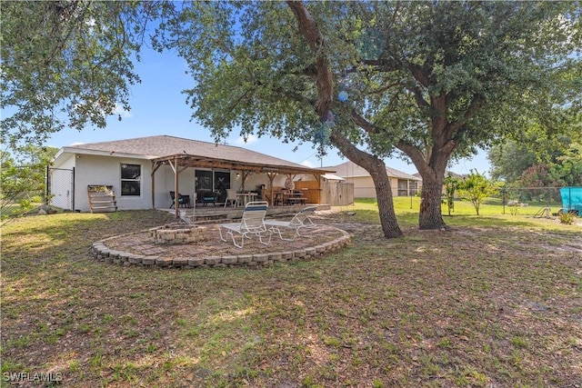 2909 48th St SW, Lehigh Acres, FL 33976 - rear view of property with a patio area and stucco siding