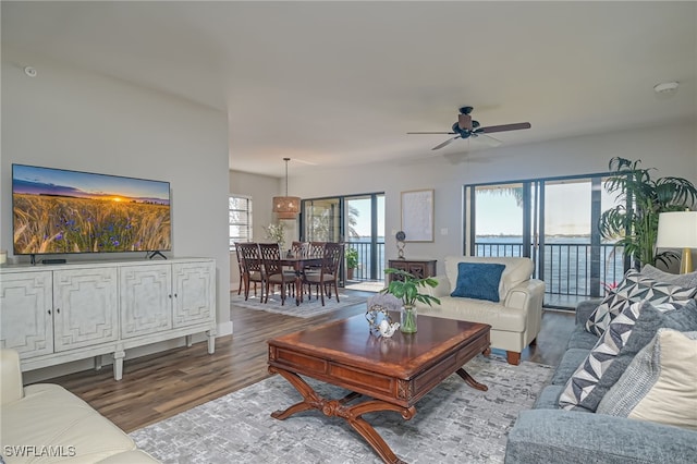1925 Clifford St Unit 101, Fort Myers, FL 33901 - living area featuring a ceiling fan, wood finished floors, and baseboards