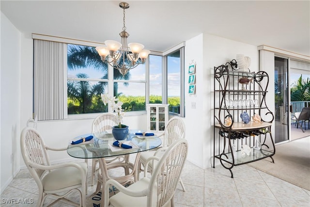 5550 Heron Point Dr W Unit 305, Naples, FL 34108 - dining space featuring a chandelier, plenty of natural light, and light tile patterned floors
