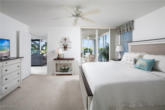 5550 Heron Point Dr W Unit 305, Naples, FL 34108 - bedroom with access to exterior, light colored carpet, and ceiling fan