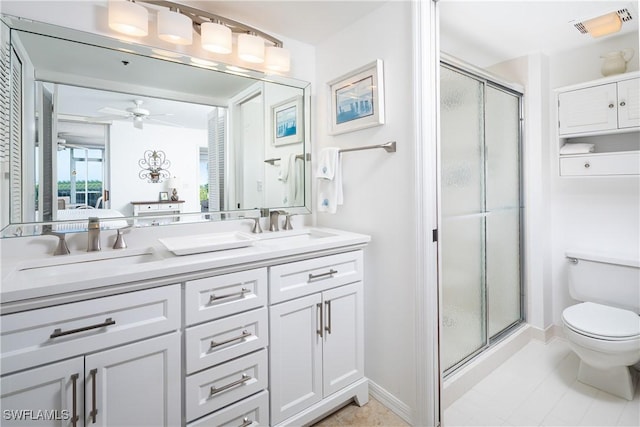 5550 Heron Point Dr W Unit 305, Naples, FL 34108 - bathroom featuring a shower stall, double vanity, toilet, and ceiling fan