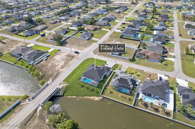 220 NE 6th St, Cape Coral, FL 33909 - aerial view of property's location with nearby suburban area and a large body of water