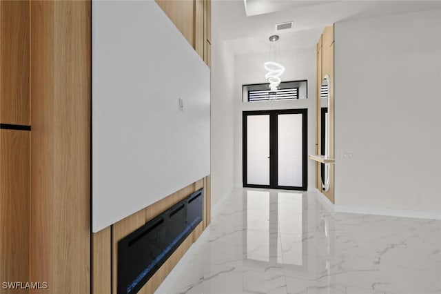 220 NE 6th St, Cape Coral, FL 33909 - entrance foyer featuring light marble finish floors and baseboards