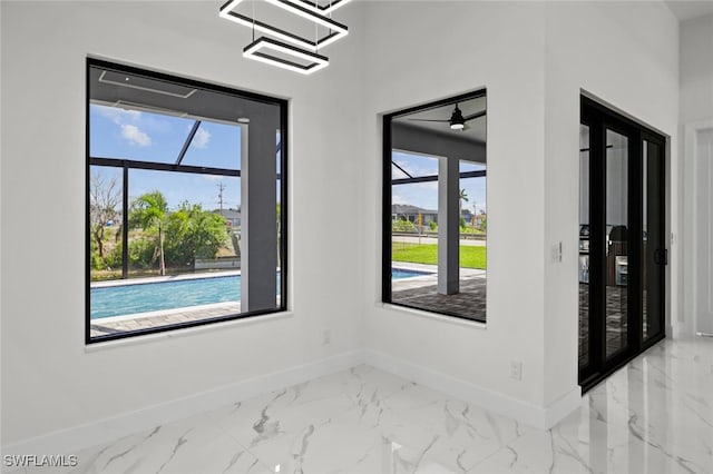 220 NE 6th St, Cape Coral, FL 33909 - empty room featuring baseboards and marble look tiles