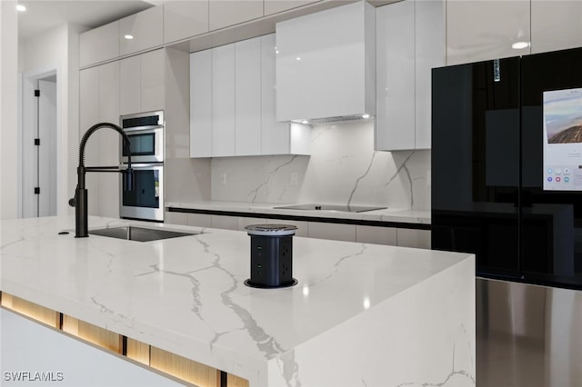 220 NE 6th St, Cape Coral, FL 33909 - kitchen with modern cabinets, white cabinets, a sink, and recessed lighting