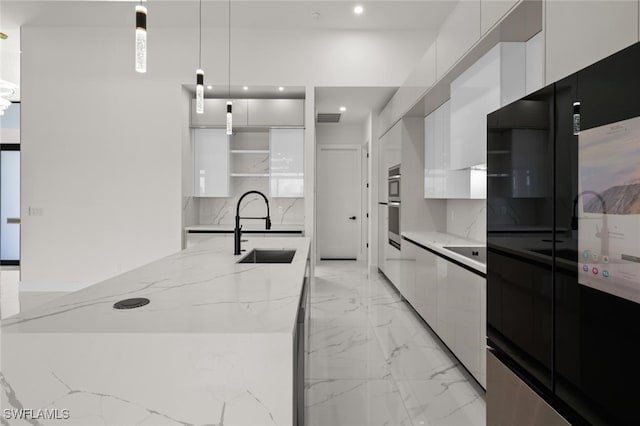 220 NE 6th St, Cape Coral, FL 33909 - kitchen with modern cabinets, a sink, white cabinetry, open shelves, and refrigerator