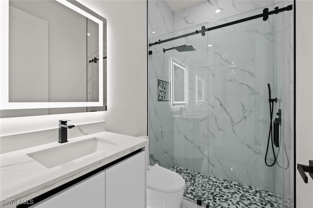220 NE 6th St, Cape Coral, FL 33909 - bathroom with vanity, a marble finish shower, and toilet