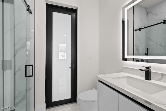 220 NE 6th St, Cape Coral, FL 33909 - full bath with marble look tile flooring, vanity, toilet, and a marble finish shower