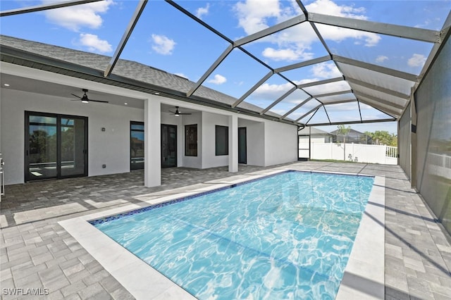 220 NE 6th St, Cape Coral, FL 33909 - view of swimming pool featuring ceiling fan, a patio area, and glass enclosure