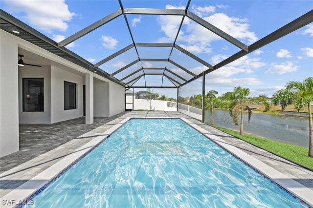 220 NE 6th St, Cape Coral, FL 33909 - swimming pool featuring a water view, a patio, and a lanai