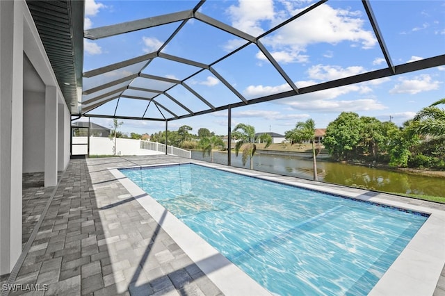 220 NE 6th St, Cape Coral, FL 33909 - outdoor pool with a water view, a patio, and glass enclosure