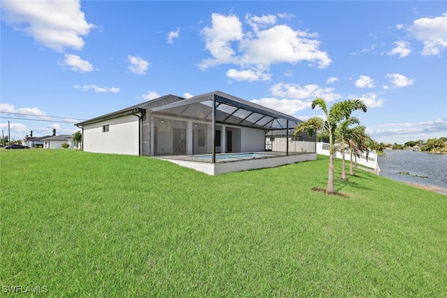220 NE 6th St, Cape Coral, FL 33909 - rear view of property with a yard, a lanai, a water view, and an outdoor pool