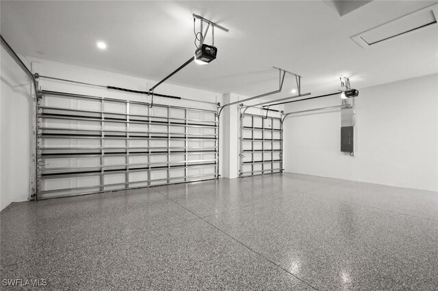 220 NE 6th St, Cape Coral, FL 33909 - garage featuring electric panel and a garage door opener