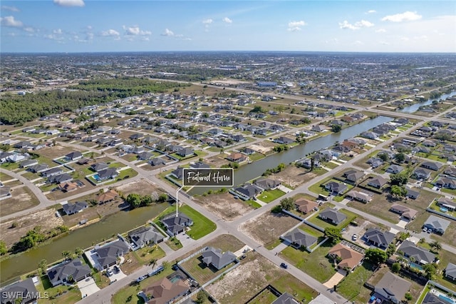 220 NE 6th St, Cape Coral, FL 33909 - aerial view of property and surrounding area featuring nearby suburban area and a nearby body of water