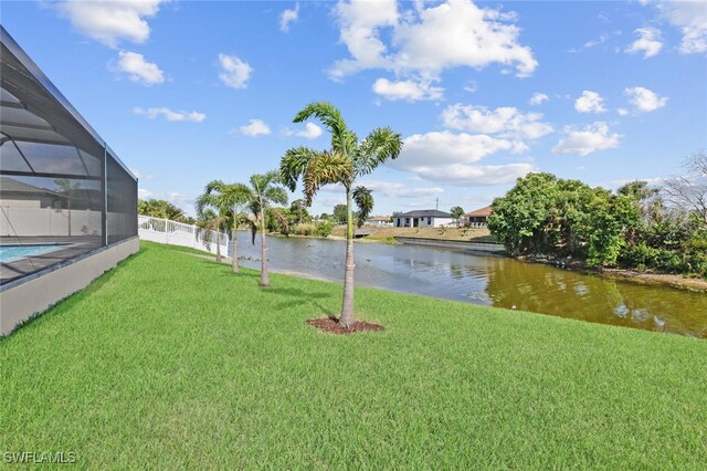 220 NE 6th St, Cape Coral, FL 33909 - view of yard with a water view and glass enclosure