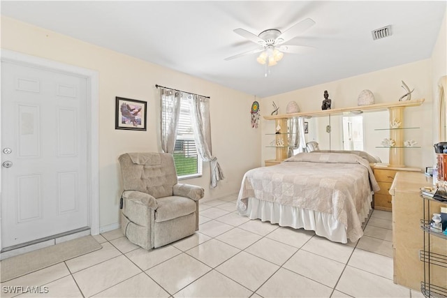 804 Alcala Ave, Lehigh Acres, FL 33936 - bedroom with light tile patterned floors and ceiling fan