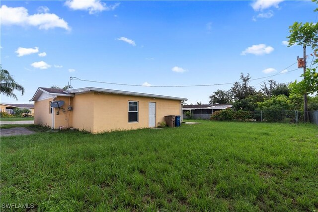 804 Alcala Ave, Lehigh Acres, FL 33936 - view of property exterior featuring stucco siding