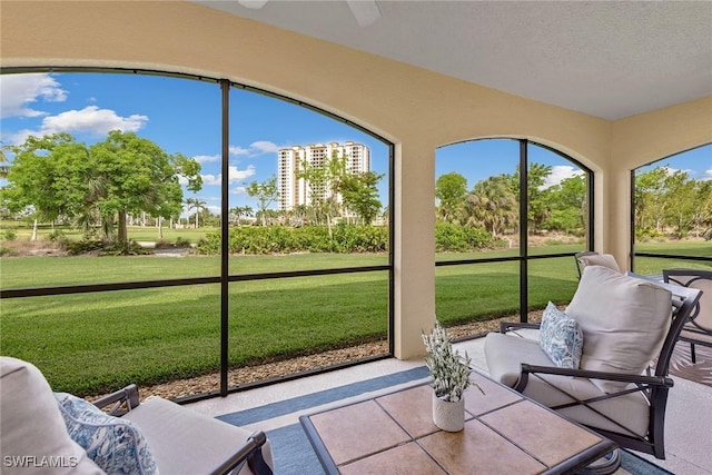1263 Rialto Way Unit 102, Naples, FL 34114 - sunroom / solarium with an outdoor living space