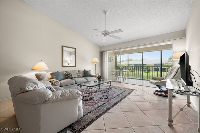 1190 Yesica Ann Cir Unit B205, Naples, FL 34110 - tiled living area with a textured ceiling, a ceiling fan, and vaulted ceiling