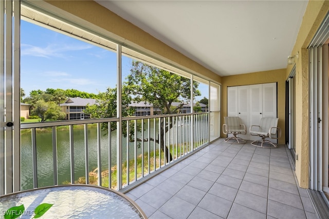 1190 Yesica Ann Cir Unit B205, Naples, FL 34110 - unfurnished sunroom with a water view