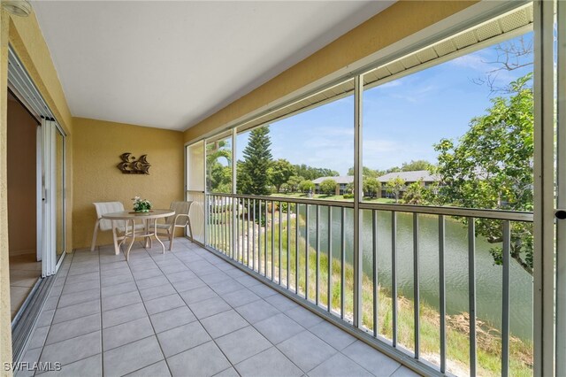 1190 Yesica Ann Cir Unit B205, Naples, FL 34110 - balcony featuring a water view