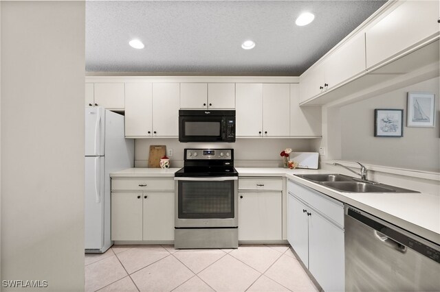 1190 Yesica Ann Cir Unit B205, Naples, FL 34110 - kitchen featuring stainless steel appliances, light tile patterned flooring, a textured ceiling, light countertops, and recessed lighting
