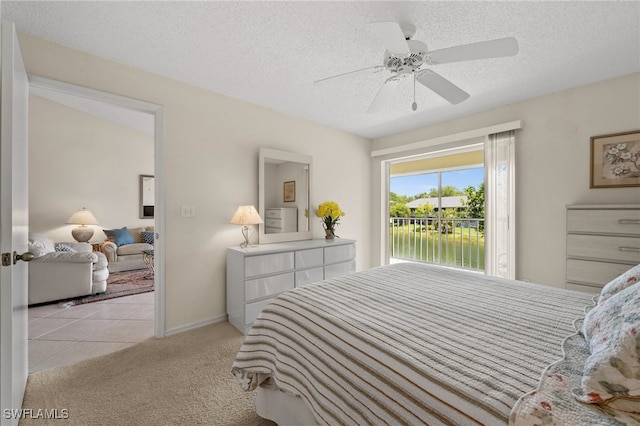 1190 Yesica Ann Cir Unit B205, Naples, FL 34110 - carpeted bedroom featuring access to outside, a textured ceiling, and ceiling fan
