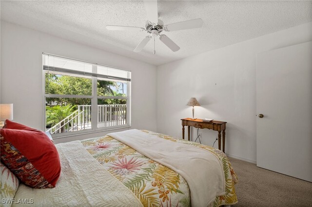 1190 Yesica Ann Cir Unit B205, Naples, FL 34110 - bedroom with a textured ceiling, carpet, and ceiling fan