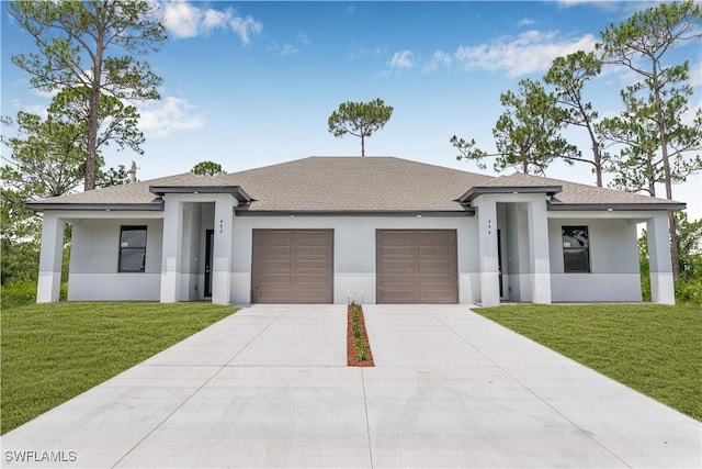 452/454 Loretta Ave S, Lehigh Acres, FL 33974 - prairie-style home featuring a garage, stucco siding, concrete driveway, a front yard, and a shingled roof