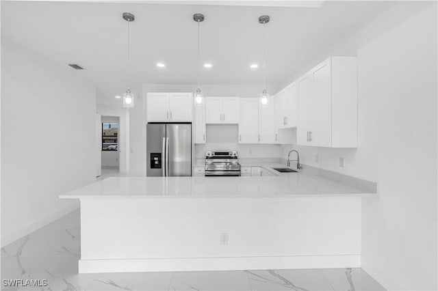 452/454 Loretta Ave S, Lehigh Acres, FL 33974 - kitchen with stainless steel appliances, light marble finish flooring, baseboards, recessed lighting, and a peninsula