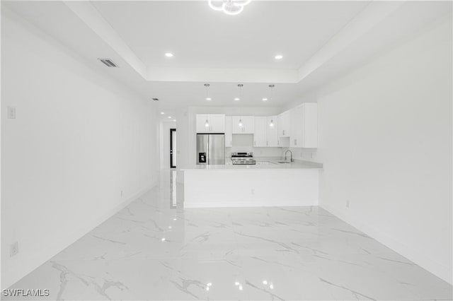 452/454 Loretta Ave S, Lehigh Acres, FL 33974 - unfurnished living room featuring baseboards, light marble finish flooring, a tray ceiling, recessed lighting, and a sink
