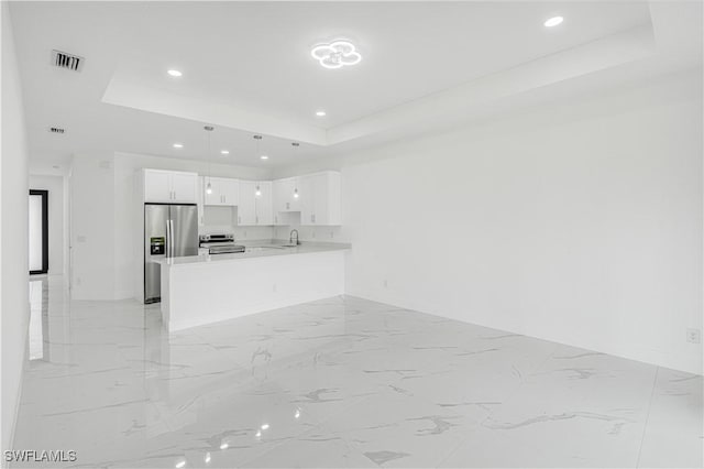 452/454 Loretta Ave S, Lehigh Acres, FL 33974 - kitchen with appliances with stainless steel finishes, a raised ceiling, a sink, baseboards, and recessed lighting